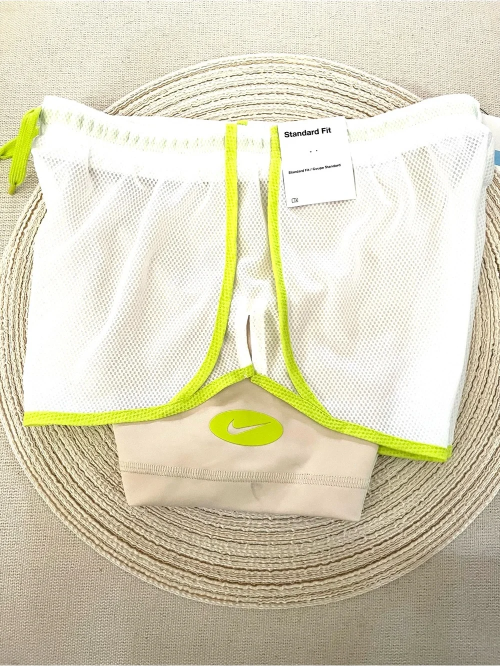 Nike Beige Sports Shorts with White Mesh Overlay and Neon Green Trim